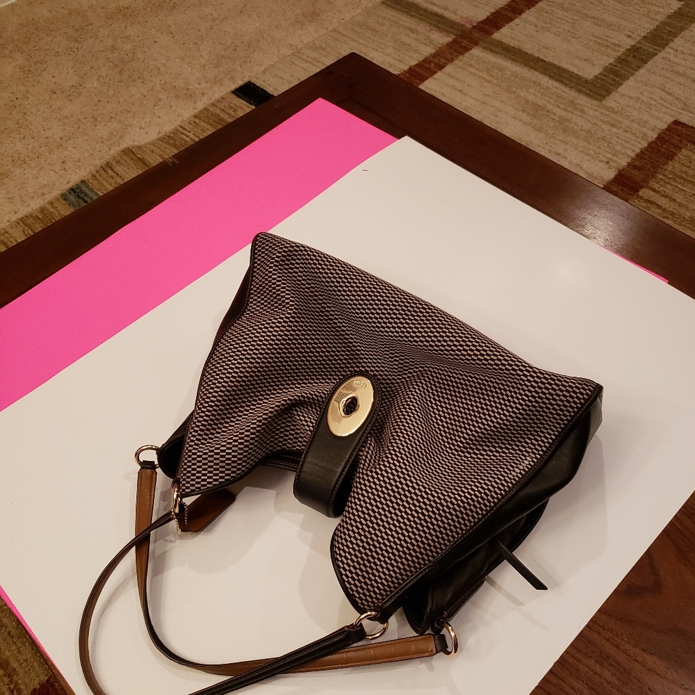 Black and Silver coach female handbag.